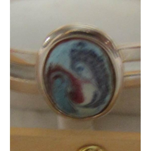 22 - An Irish silver plate and enamel bracelet.