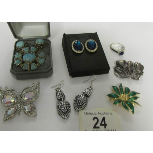 24 - 4 brooches, 3 pairs of earrings and a ring.