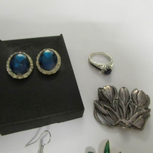 24 - 4 brooches, 3 pairs of earrings and a ring.