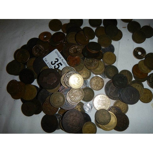 35 - A box of assorted coins including George III, Victorian gaming tokens etc.,