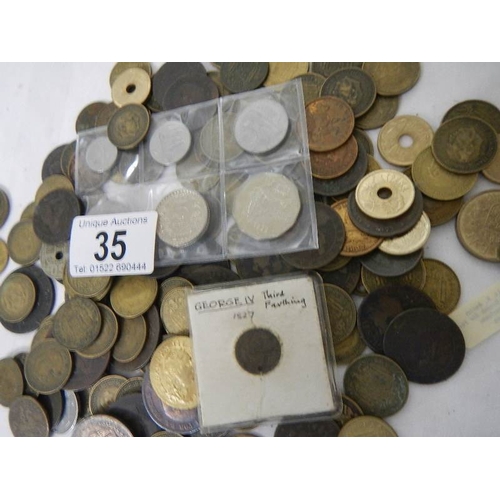 35 - A box of assorted coins including George III, Victorian gaming tokens etc.,