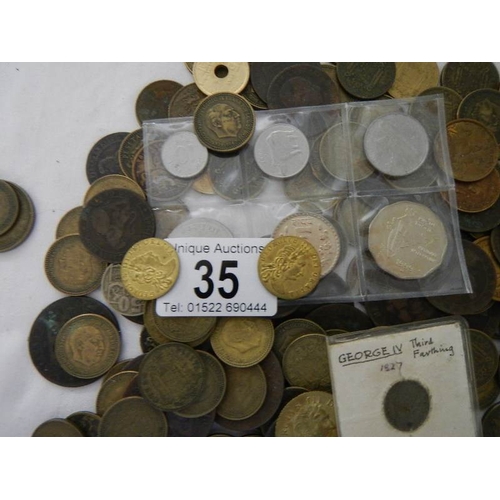 35 - A box of assorted coins including George III, Victorian gaming tokens etc.,