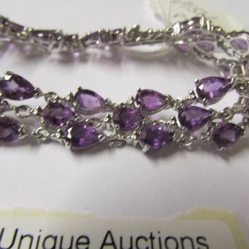 38 - An amethyst bracelet - 39 amethysts set in silver.