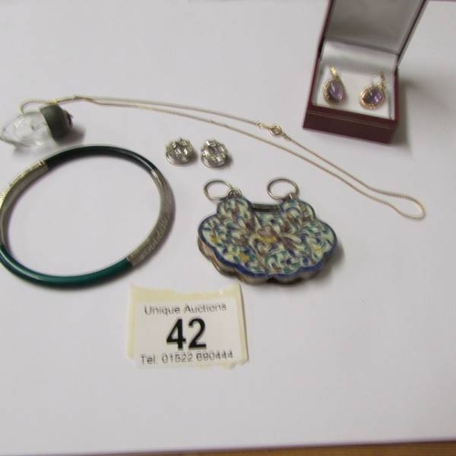 42 - A cone shaped perfume bottle, a green bangle, amethyst ear pendants and enamelled items etc.,