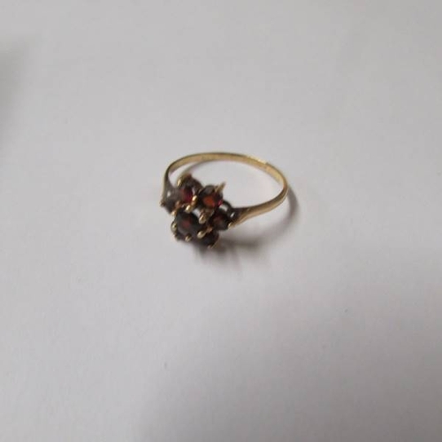 44 - A garnet set ring in 9ct gold size p and a sapphire set ring in 9ct gold size L half.