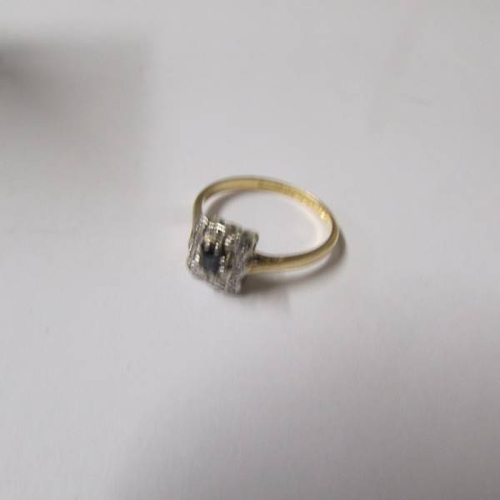 49 - A diamond and sapphire square cluster ring dated Birmingham 1941 in 18ct gold, size L.