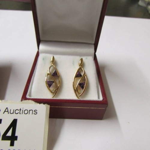 54 - A pair of cameo earrings with female profile and a pair of amethyst pendant earrings in 9ct gold.