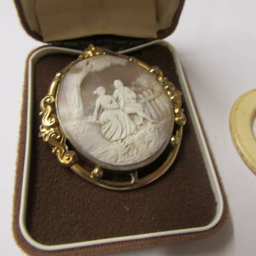 55 - A Victorian cameo brooch and other jewellery including gold earrings, agate cross. silver teething r... 