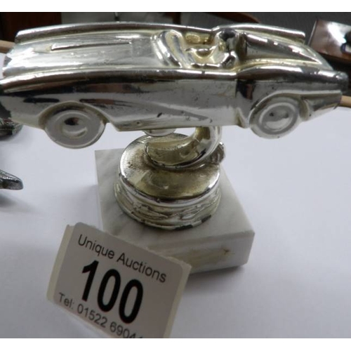 100 - A 1950's Civil Service Motoring association car badge and a racing car trophy.