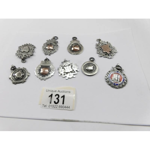 131 - 9 silver watch fobs.