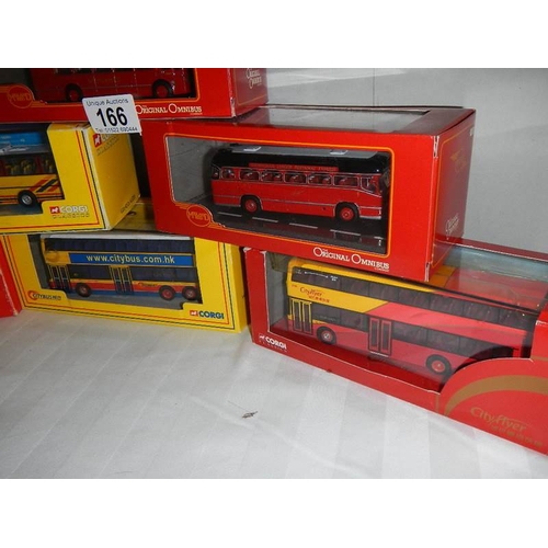 166 - Seven die cast Corgi model buses.