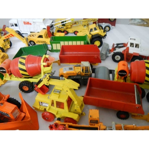 179 - Approximately 68 construction and farming related die cast models.