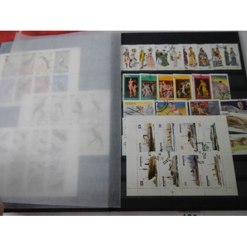 180 - 2 albums of worldwide Cinderella and back of book stamps.