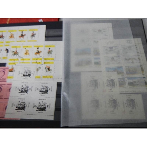 180 - 2 albums of worldwide Cinderella and back of book stamps.