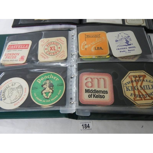 184 - 2 albums of whisky labels and mid 20th century beer mats.