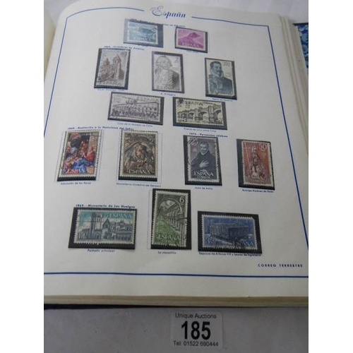 185 - A good collection of Spanish stamps in 5 albums plus reference books.