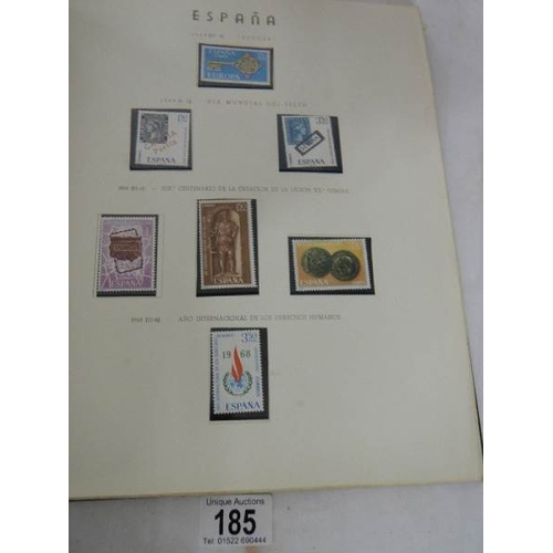 185 - A good collection of Spanish stamps in 5 albums plus reference books.