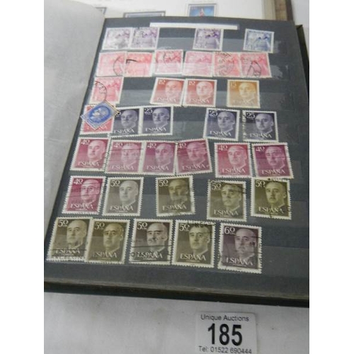 185 - A good collection of Spanish stamps in 5 albums plus reference books.