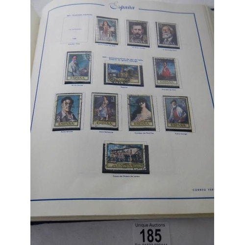 185 - A good collection of Spanish stamps in 5 albums plus reference books.