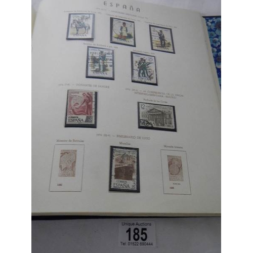 185 - A good collection of Spanish stamps in 5 albums plus reference books.