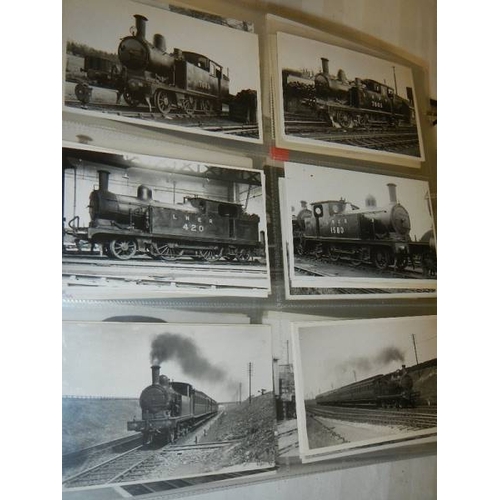 188 - An album of in excess of 500 railway related postcards and photographs.