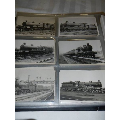 188 - An album of in excess of 500 railway related postcards and photographs.