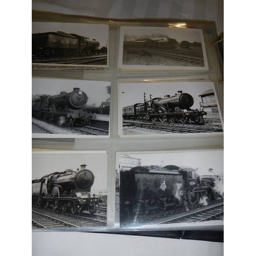 188 - An album of in excess of 500 railway related postcards and photographs.