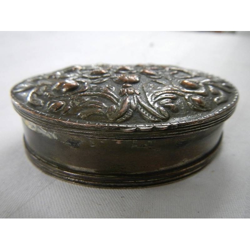 200 - An old silver plate on copper snuff box with embellished top.