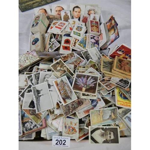 202 - Approximately 200 loose tea and cigarette cards including Wills, Players, Gallaher etc.,