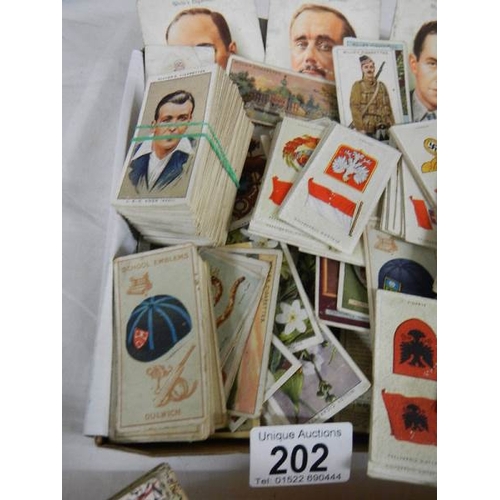 202 - Approximately 200 loose tea and cigarette cards including Wills, Players, Gallaher etc.,