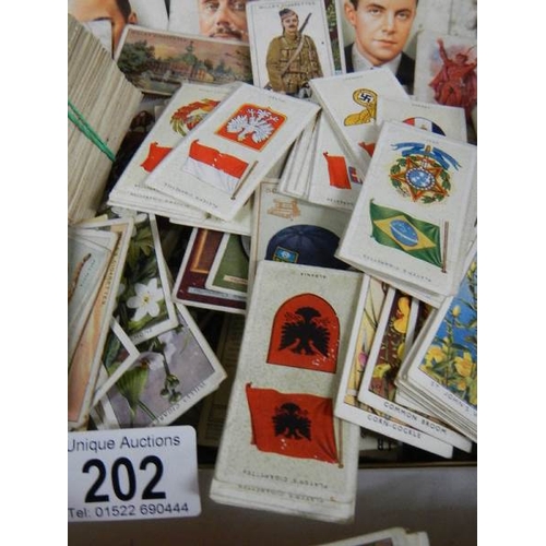 202 - Approximately 200 loose tea and cigarette cards including Wills, Players, Gallaher etc.,