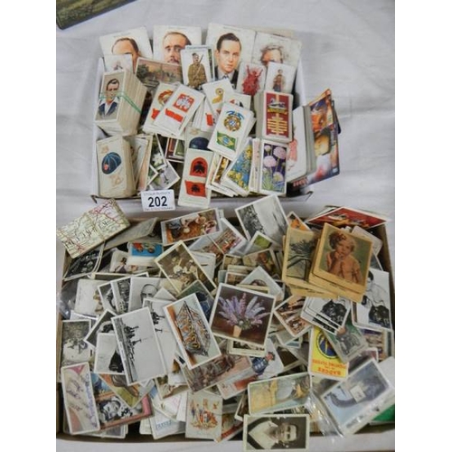 202 - Approximately 200 loose tea and cigarette cards including Wills, Players, Gallaher etc.,