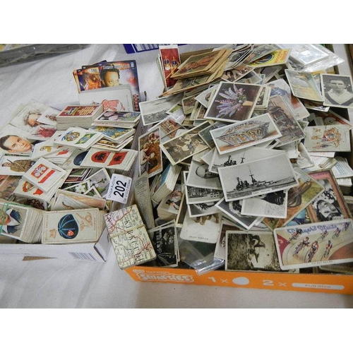 202 - Approximately 200 loose tea and cigarette cards including Wills, Players, Gallaher etc.,