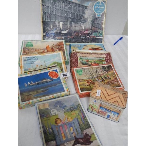 203 - A quantity of vintage wooden jigsaw puzzles.