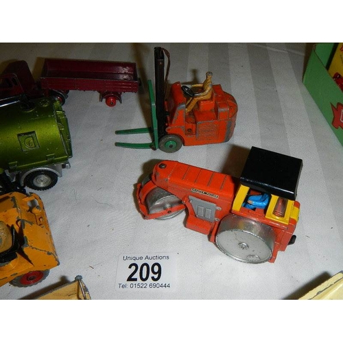 209 - A quantity of Dinky commercial vehicles including Bedford, road roller etc.,