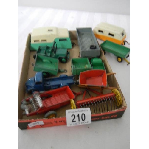 210 - A mixed lot of Dinky caravans, trailers and farm implements etc.,