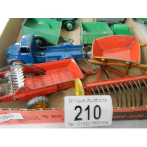 210 - A mixed lot of Dinky caravans, trailers and farm implements etc.,