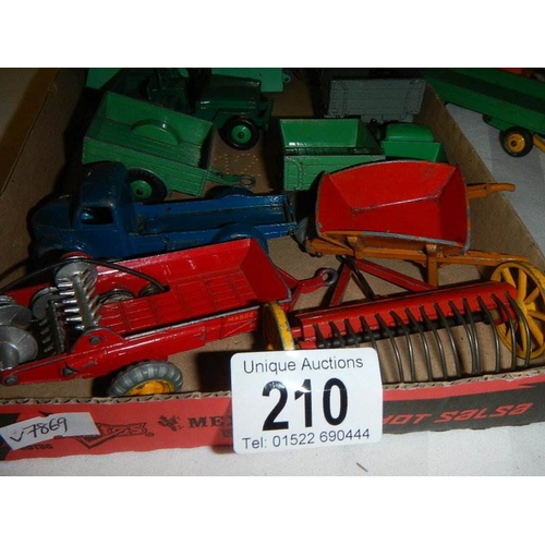 210 - A mixed lot of Dinky caravans, trailers and farm implements etc.,