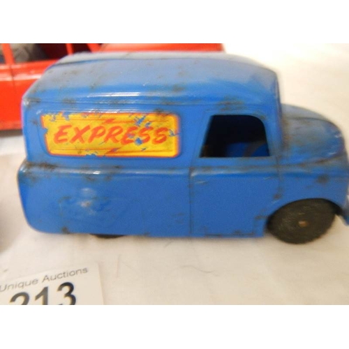 213 - A Triang tinplate clockwork Ford Zephyr, a Plastic friction fire chief car and an express van.