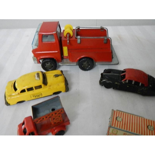 216 - A quantity of tinplate and plastic friction toys including Mettoy.