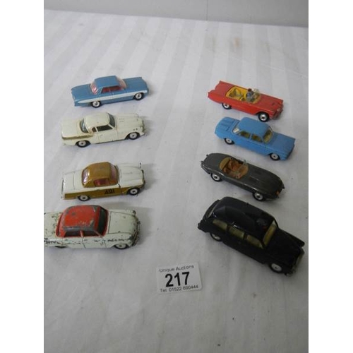 217 - 8 Corgi toys including Ford, Triumph, Jaguar etc.,