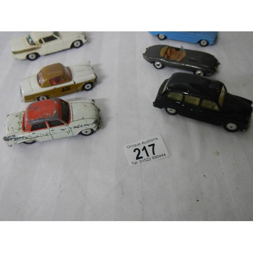 217 - 8 Corgi toys including Ford, Triumph, Jaguar etc.,