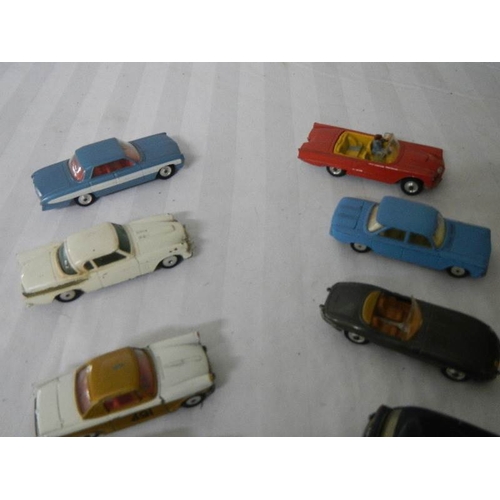 217 - 8 Corgi toys including Ford, Triumph, Jaguar etc.,