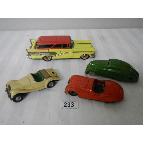 233 - 2 tinplate Scalex friction cars, a Bandai American estate car and one other.