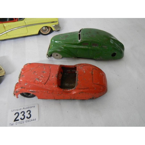 233 - 2 tinplate Scalex friction cars, a Bandai American estate car and one other.