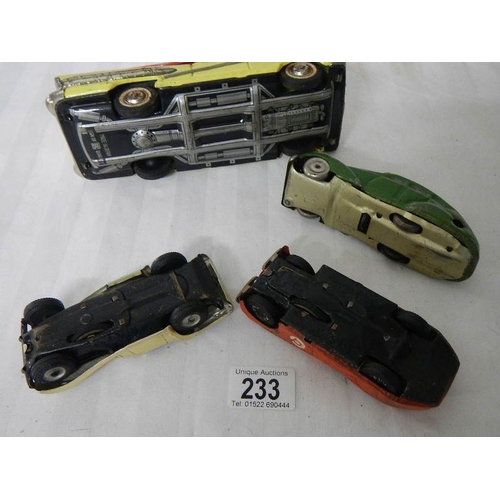 233 - 2 tinplate Scalex friction cars, a Bandai American estate car and one other.