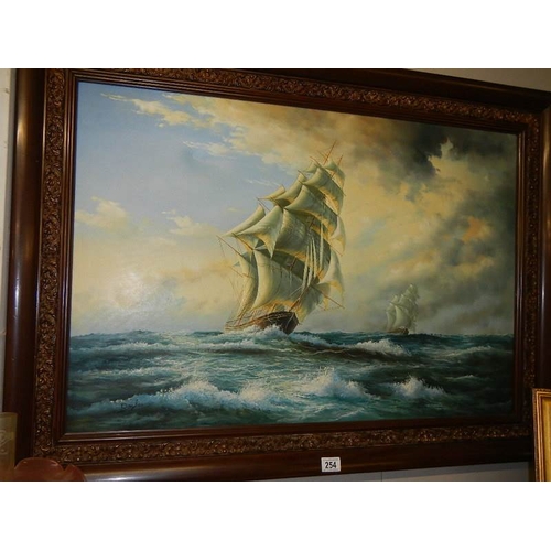 254 - A large oil on canvas seascape depicting sailing ships on rough seas.