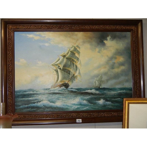 254 - A large oil on canvas seascape depicting sailing ships on rough seas.