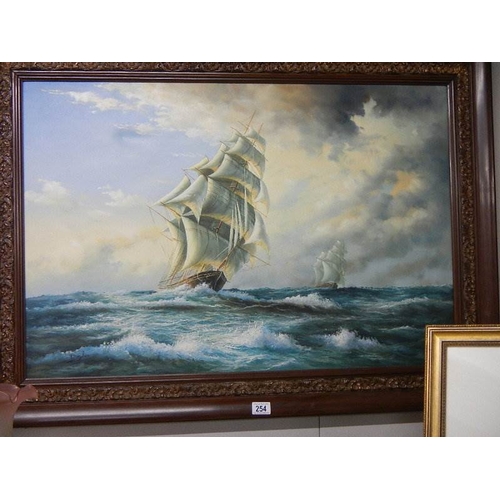 254 - A large oil on canvas seascape depicting sailing ships on rough seas.