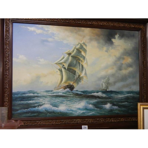 254 - A large oil on canvas seascape depicting sailing ships on rough seas.